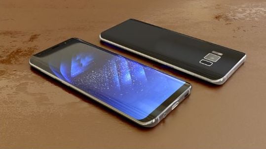 Two cell phones on a table facing up and down.